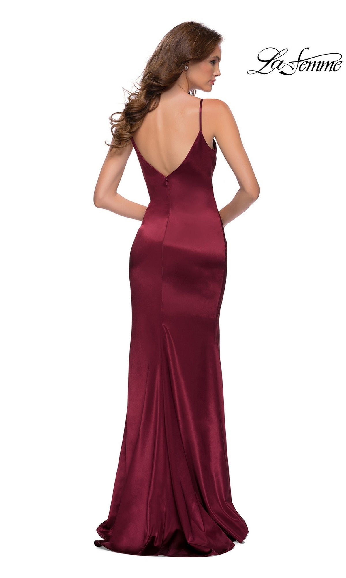 Model wearing the Long Prom Dress: La Femme 29960—a floor-length, sleeveless burgundy satin gown with a fitted sheath skirt and low back—against a white backdrop.